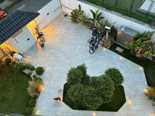 an overhead view of a patio with plants and bikes at Fregene Tiny house close to the sea in Fregene