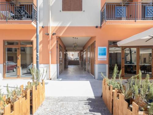 a hallway of a building with potted plants at Verga in Balestrate