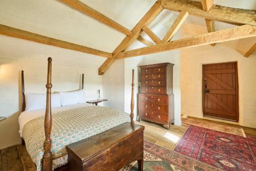 a bedroom with a wooden bed and a wooden dresser at Host & Stay - Beamish Museum Cottages in Beamish