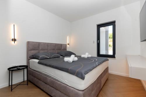 Ένα ή περισσότερα κρεβάτια σε δωμάτιο στο Olive Residence