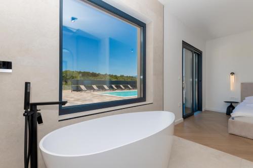 Ένα ή περισσότερα κρεβάτια σε δωμάτιο στο Olive Residence