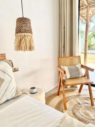 Una cama o camas en una habitación de CASA BUKO Tropical Homes El Nido