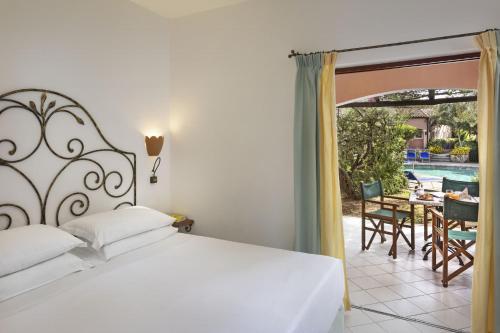 Postel nebo postele na pokoji v ubytování Residence Cala Di Falco