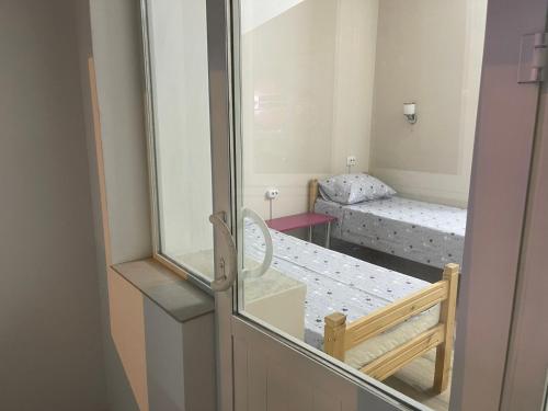 Postel nebo postele na pokoji v ubytování Hostel Vertum
