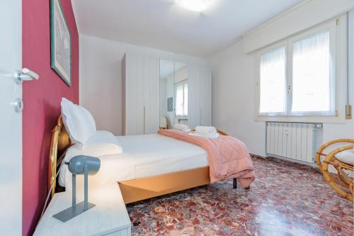 A bed or beds in a room at Appartamento Milly