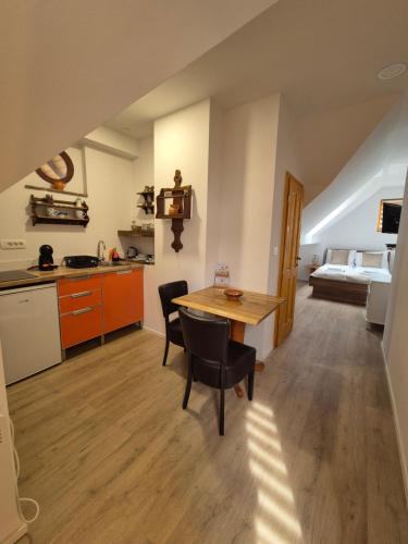 a kitchen and dining room with a table and chairs at Slovenian House Vida in Bled