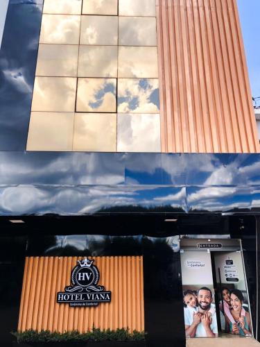 two pictures of a building with a sign on it at HOTEL VIANA in Barra do Corda
