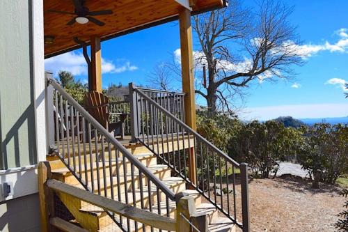a set of stairs on a house with a roof at Elkstone Panoramic Views from Blowing Rock to Grandfather in Blowing Rock
