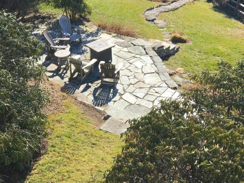 an aerial view of a patio with a table and chairs at Elkstone Panoramic Views from Blowing Rock to Grandfather in Blowing Rock