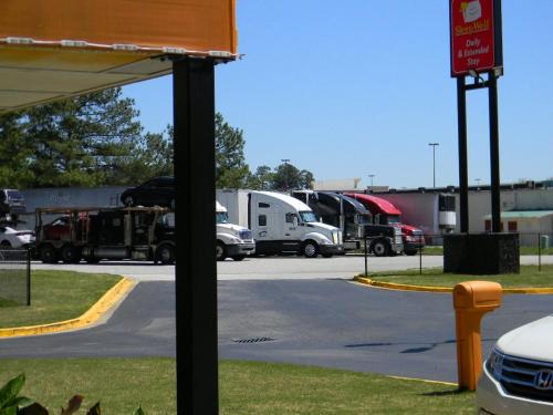 a group of trucks parked in a parking lot at SleepWell Stockbridge in Stockbridge