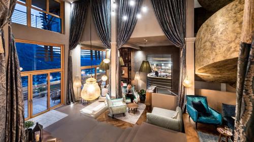 an aerial view of a living room with a large window at Hotel Valentinerhof in Siusi