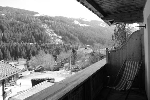a balcony with a view of a snow covered mountain at Gästehaus Waldruh in Gerlos
