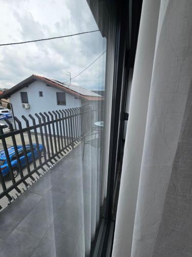 a view from a window of a balcony at Filipovic rent a car & apartments in Selnica Šćitarjevska