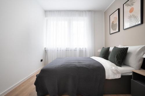 Ένα ή περισσότερα κρεβάτια σε δωμάτιο στο Central Bonn Apartments I private parking I home2share