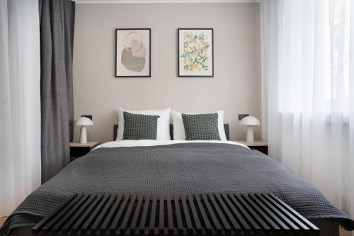 Ένα ή περισσότερα κρεβάτια σε δωμάτιο στο Central Bonn Apartments I private parking I home2share
