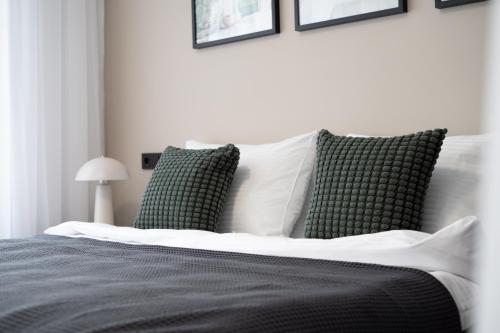Ένα ή περισσότερα κρεβάτια σε δωμάτιο στο Central Bonn Apartments I private parking I home2share