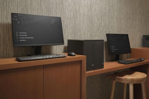 a computer monitor and a keyboard and mouse on a desk at SpringHill Suites by Marriott Lexington Frankfort in Frankfort