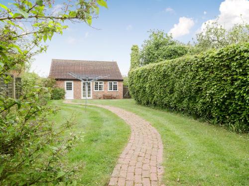 a brick path leading to a house at Crabtrees in Ringstead