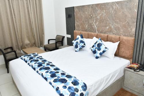 Postel nebo postele na pokoji v ubytování Hotel Ananta Inn