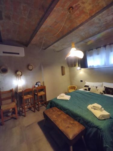 Ένα ή περισσότερα κρεβάτια σε δωμάτιο στο La Dimora della Corte