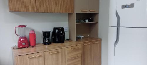 a kitchen with a counter with a blender on it at Casa ideal 5 quatros sendo 3 suítes 2 km do centro in Bananeiras