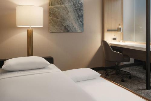 a hotel room with two beds and a desk at SpringHill Suites by Marriott Lexington Frankfort in Frankfort