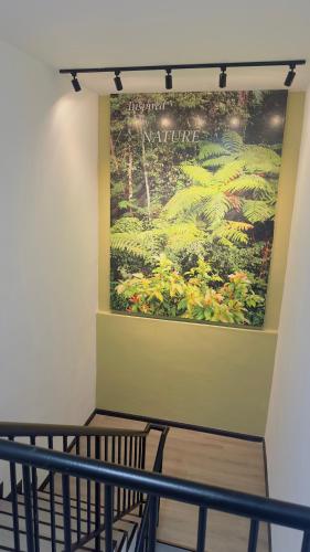 a large painting on the wall of a room at D GAYA HOTEL Cameron Highlands in Tanah Rata