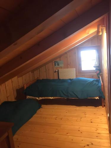 Ένα ή περισσότερα κρεβάτια σε δωμάτιο στο Chalet La Grangette