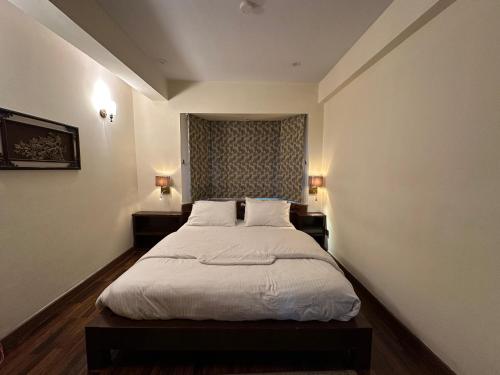 Ένα ή περισσότερα κρεβάτια σε δωμάτιο στο Sarah's Lodge