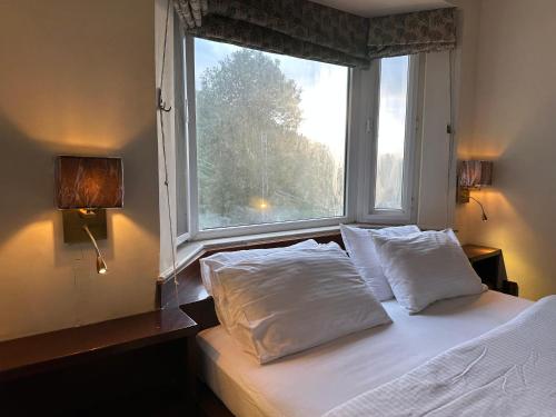Ένα ή περισσότερα κρεβάτια σε δωμάτιο στο Sarah's Lodge