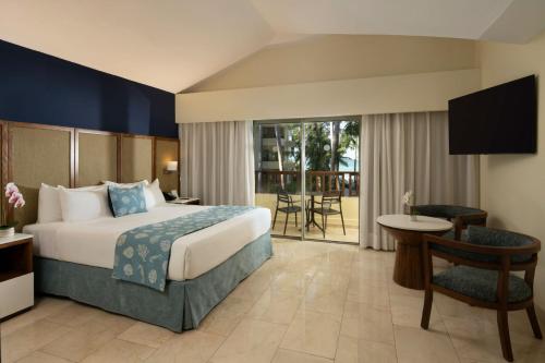 Un ou plusieurs lits dans un hébergement de l'établissement Impressive Premium Punta Cana - All Inclusive