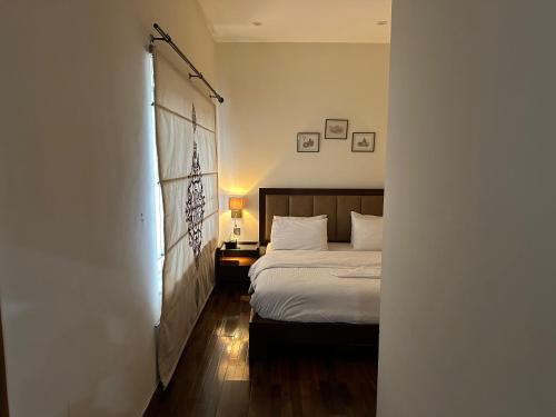 Ένα ή περισσότερα κρεβάτια σε δωμάτιο στο Sarah's Lodge