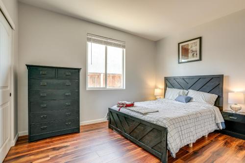 a bedroom with a large bed and a window at 7 Mi to Dtwn Home with Fenced Yard in Roseville! in Roseville