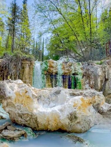 a waterfall in the middle of a river at L' antico lavatoio in Radicofani
