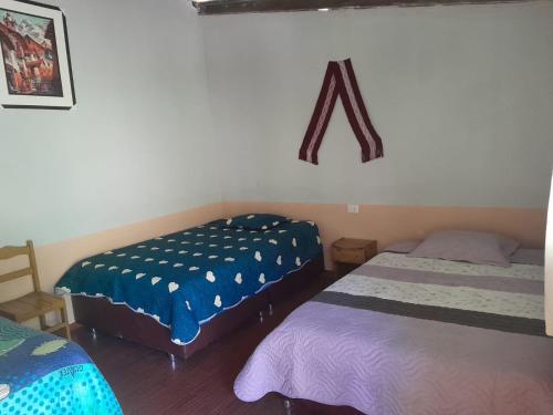 Postel nebo postele na pokoji v ubytování Hospedaje el Mirador