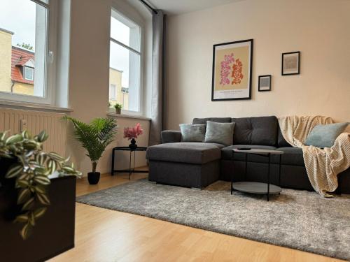 a living room with a couch and a rug at Ferienwohnung Himmelslicht in Frohse