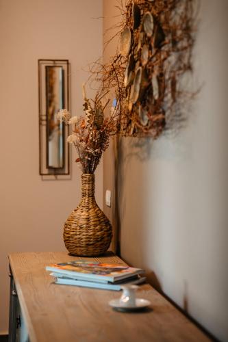 a vase sitting on top of a table at The Tribe Alpaca Retreat in Brăneşti