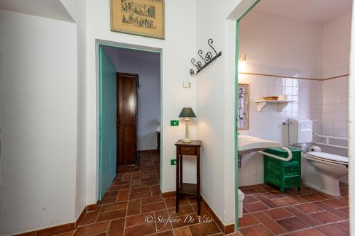 a bathroom with a toilet and a sink at Il Borgo Del Lupo Relax Family Apartments in Tuscany with Restaurant & Swimming Pool in Sarteano