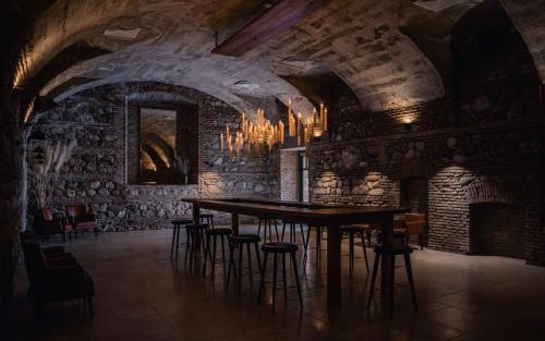 a dining room with a table and some chairs at Tsinandali Estate, A Radisson Collection Hotel in Tsinandali