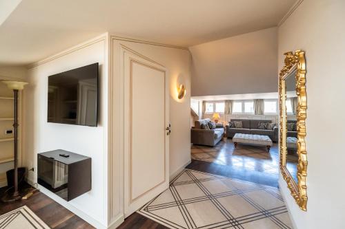 a hallway of a living room with a mirror at Palazzo Porta Picta in Bergamo
