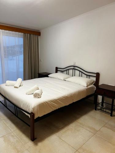 Ένα ή περισσότερα κρεβάτια σε δωμάτιο στο Pandora Apartment Haraki