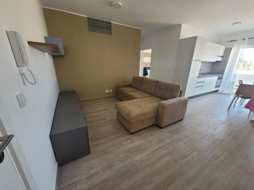 a living room with a couch and a table at Appartamenti Praia Estoril, Sal Rei, Boa Vista in Sal Rei