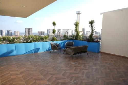 a room with chairs and a table on a roof at Radisson Hotel Mersin in Mersin