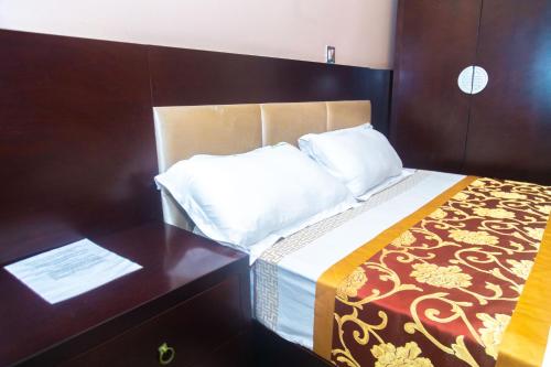 Ένα ή περισσότερα κρεβάτια σε δωμάτιο στο Eden palace