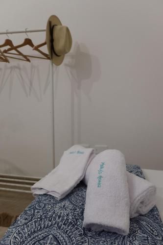 two towels sitting on top of a bed at Molly's Home Otranto in Otranto