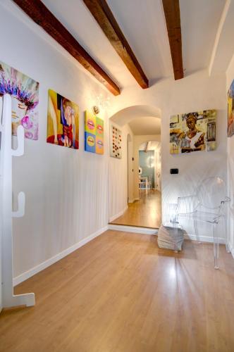 a room with white walls with paintings on the walls at Moscova Luxury B&B in Milan