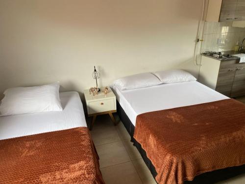 Postel nebo postele na pokoji v ubytování Envigado Loft
