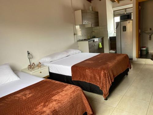 Postel nebo postele na pokoji v ubytování Envigado Loft