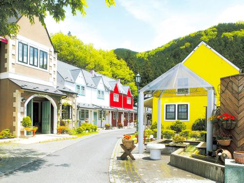 a street in a small town with houses at Hotel Euro City in Nikko