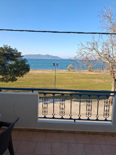 a balcony with a view of the ocean at Alexandra Studios in Néos Pírgos